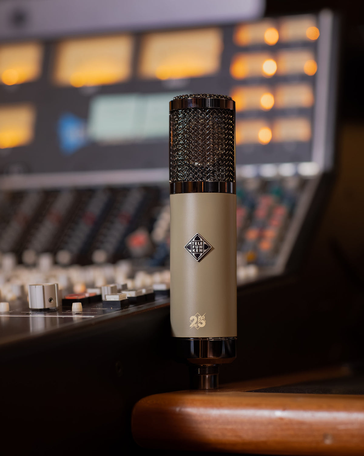Vintage Green TF51 25th Anniversary Edition in front of an analogue recording console